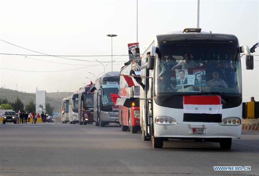 SYRIA-DAMASCUS-LEBANON-REFUGEES-RETURNING