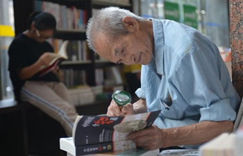 People read at Xinhua Bookstore in Changsha, C China