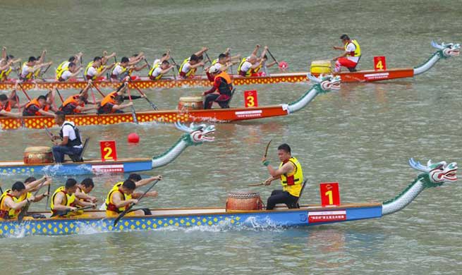 People take part in dragon boat match in Wenzhou, east China