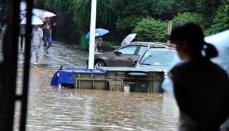 Roads waterlogged after heavy rainfall in central China's city